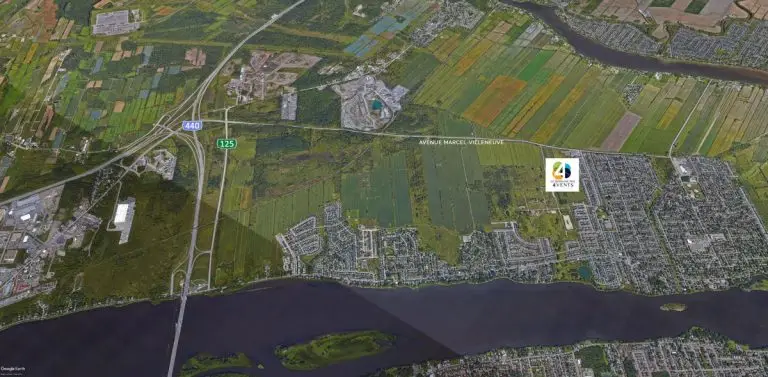 Vue aérienne de terrains et quartiers près d’une rivière à Laval, secteur d’un projet immobilier Laval indiqué sur carte.